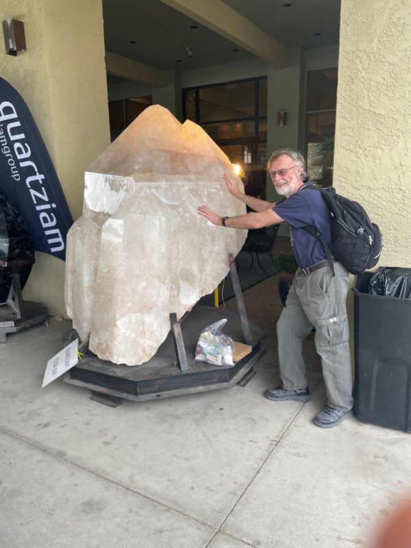 OVMC member Dave Maclean and a giant quartz crystal carving at the Pueblo mineral show, Tucson 2025 OVMC member Dave Maclean and a giant quartz crystal carving at the Pueblo mineral show, Tucson 2025